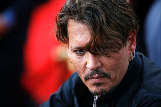 Actor Johnny Depp arrives on the red carpet for the global premiere of the film Pirates of the Caribbean: Dead Men Tell No Tales, in Shanghai. (REUTERS) Actor Johnny Depp arrives on the red carpet for the global premiere of the film Pirates of the Caribbean: Dead Men Tell No Tales, in Shanghai. (REUTERS)