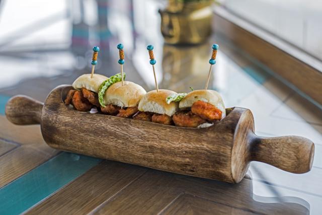 The jhinga pao was a winner, the plump prawns fried Koliwada style and nestled in buttery sliders. (Pratik Chorge / HT Photo)