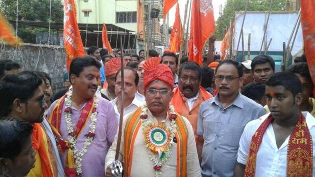 The Sangh parivar organised Ram Navami on an unprecedented scale in Bengal this year. BJP state president Dilip Ghosh (carrying sword) took part in a procession in Kharagpur which is his Assembly constituency. (HT Photo) The Sangh parivar organised Ram Navami on an unprecedented scale in Bengal this year. BJP state president Dilip Ghosh (carrying sword) took part in a procession in Kharagpur which is his Assembly constituency. (HT Photo)