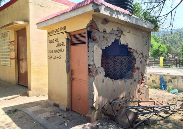 The damaged wall at a government school following firing of mortar shells by Pakistan at Nowshera on May 11. (PTI) The damaged wall at a government school following firing of mortar shells by Pakistan at Nowshera on May 11. (PTI)