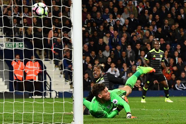 Chelsea Football Club's Belgian striker Michy Batshuayi scores the winning goal past West Bromwich Albion's English goalkeeper Ben Foster during their English Premier League match at The Hawthorns stadium in West Bromwich, West Midlands, on Friday. (AFP)