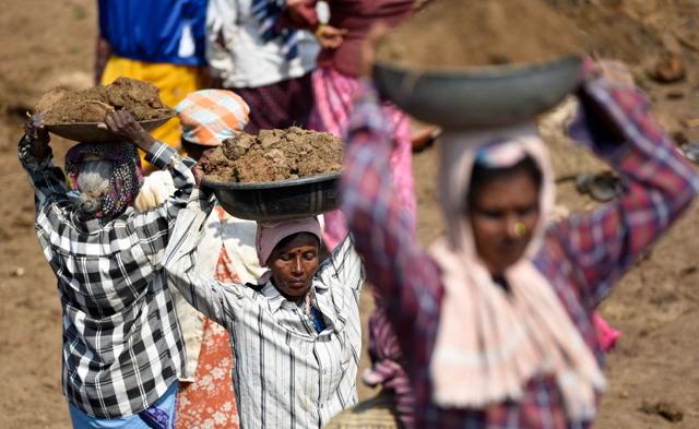 Women working at a lake rejuvenation project at Mandya, Karnataka. (Arijit Sen/HT Photo) Women working at a lake rejuvenation project at Mandya, Karnataka. (Arijit Sen/HT Photo)
