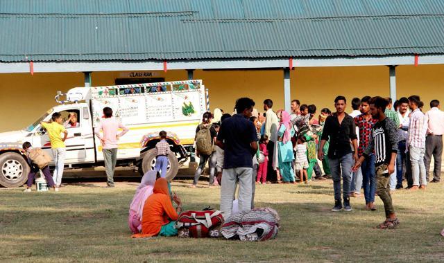 Residents of border villages in Nowshera gather at a relief camp on Saturday. (PTI) Residents of border villages in Nowshera gather at a relief camp on Saturday. (PTI)