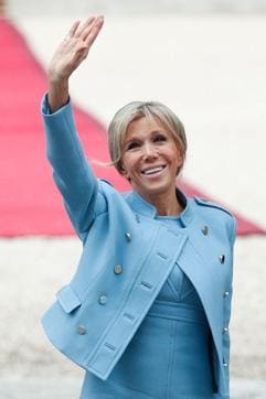 Brigitte Trogneux gestures as she arrives at the Elysee presidential Palace to attend her husband Emmanuel Macron's formal inauguration ceremony as French President on Sunday in Paris. (AFP Photo)