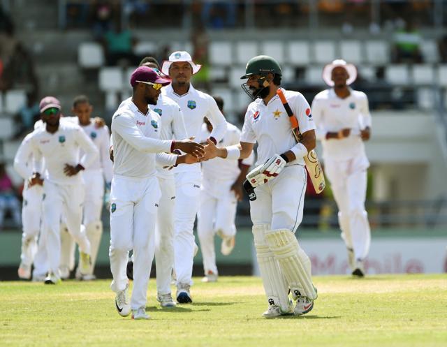 Pakistan captain Misbah-ul-Haq shakes hands with members of the West Indies team as he leaves the field for the last time before his retirement on the fourth day’s play of the final Test match at the Windsor Park Stadium in Roseau, Dominica on Saturday. Misbah was caught by wicketkeeper Shane Dowrich off the bowling of Devendra Bishoo for 2 runs. (AFP) Pakistan captain Misbah-ul-Haq shakes hands with members of the West Indies team as he leaves the field for the last time before his retirement on the fourth day’s play of the final Test match at the Windsor Park Stadium in Roseau, Dominica on Saturday. Misbah was caught by wicketkeeper Shane Dowrich off the bowling of Devendra Bishoo for 2 runs. (AFP)