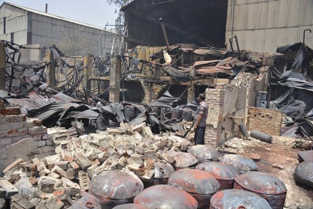 The department also roped in a foam tender from neighbouring Noida as the fire also spread to chemicals stored at the unit. (Sakib Ali /HT Photo) The department also roped in a foam tender from neighbouring Noida as the fire also spread to chemicals stored at the unit. (Sakib Ali /HT Photo)