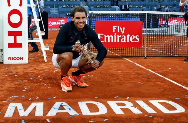 Rafael Nadal poses with his trophy after he won the Madrid Open on May 14, 2017. (AFP)