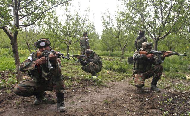 Army soldiers take position during an operation against militants in Shopian district. (Waseem Andrabi/HT Photo) Army soldiers take position during an operation against militants in Shopian district. (Waseem Andrabi/HT Photo)