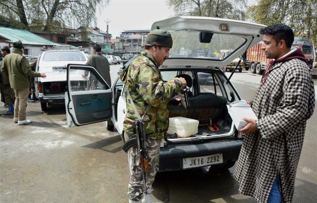 Jammu and Kashmir police's special operation group inspects vehicle in Srinagar. (PTI File Photo) Jammu and Kashmir police's special operation group inspects vehicle in Srinagar. (PTI File Photo)