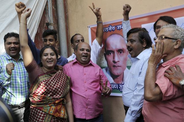 Friends of Kulbhushan Jadhav celebrate in Mumbai on Thursday. (AP) Friends of Kulbhushan Jadhav celebrate in Mumbai on Thursday. (AP)