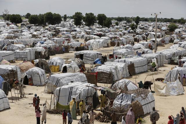 File photo from August 2016 file photo shows a general view of one of the biggest camps for people displaced by Islamist extremists in Maiduguri, Nigeria. Camps for thousands of people displaced by Boko Haram will have to stay open beyond the end of this month as Nigeria's military continues to fight the extremists in so-called liberated areas, officials say. The governor of the northern state of Borno, Kashim Shettima, told reporters on May 16, 2017 it is not yet safe to return people to their homes in many places across the region. (AP) File photo from August 2016 file photo shows a general view of one of the biggest camps for people displaced by Islamist extremists in Maiduguri, Nigeria. Camps for thousands of people displaced by Boko Haram will have to stay open beyond the end of this month as Nigeria's military continues to fight the extremists in so-called liberated areas, officials say. The governor of the northern state of Borno, Kashim Shettima, told reporters on May 16, 2017 it is not yet safe to return people to their homes in many places across the region. (AP)