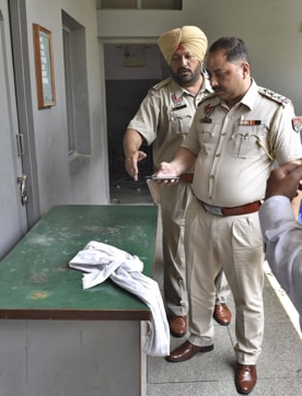 Police officials inspecting the spot on Friday. (Gurpreet Singh/HT Photo) Police officials inspecting the spot on Friday. (Gurpreet Singh/HT Photo)