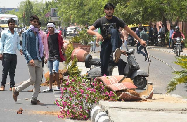 Students break flower pots during their protest. (HT Photo)