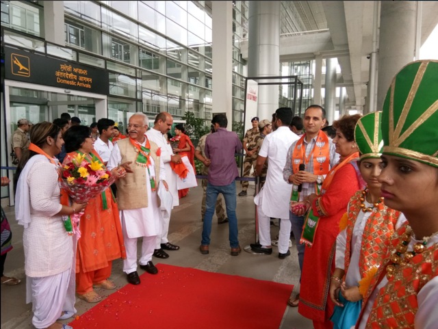Party workers waiting to receive Amit Shah at the airport on Saturday. (HT Photo)