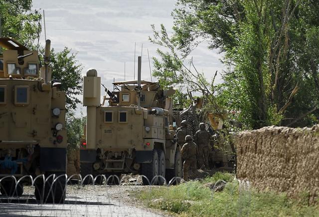 US soldiers inspect the site of a roadside bomb blast at Abed Kheel near Charikar district of Parwan province. (AFP Photo) US soldiers inspect the site of a roadside bomb blast at Abed Kheel near Charikar district of Parwan province. (AFP Photo)