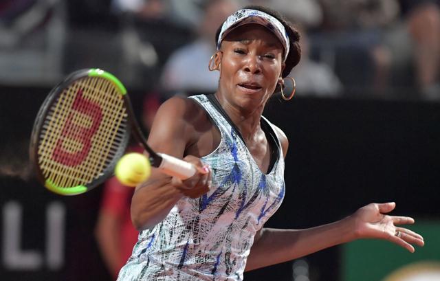 Venus Williams of US returns the ball to Garbine Muguruza of Spain. (AFP) Venus Williams of US returns the ball to Garbine Muguruza of Spain. (AFP)