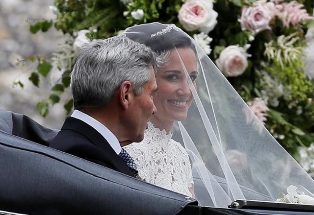 Pippa Middleton, the sister of Britain's Catherine, Duchess of Cambridge, arrives with her father Michael Middleton for her wedding to James Matthews at St Mark's Church in Englefield, west of London, on May 20. (Reuters) Pippa Middleton, the sister of Britain's Catherine, Duchess of Cambridge, arrives with her father Michael Middleton for her wedding to James Matthews at St Mark's Church in Englefield, west of London, on May 20. (Reuters)