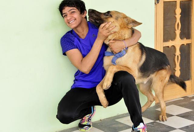 When not practicing on the mat, Ritu enjoys listening to music (HT Photo) When not practicing on the mat, Ritu enjoys listening to music (HT Photo)