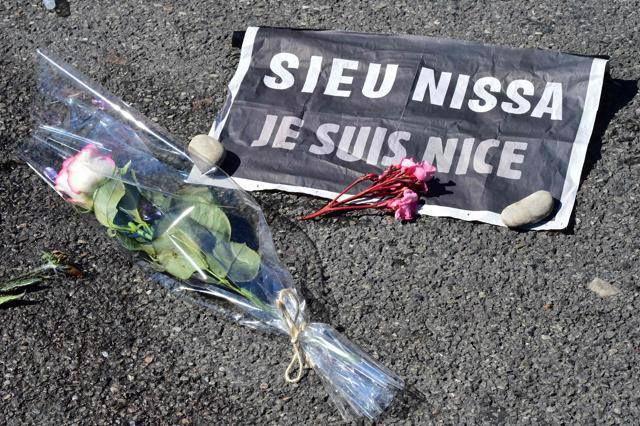 Arose and a sign reading "Je suis Nice" (I am Nice) is placed near a stain on the pavement on la Promenade des Anglais in tribute to the victims of the deadly Bastille Day attack in Nice. (AFP File Photo)