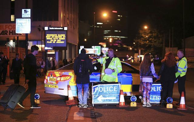 Emergency services work at Manchester Arena after reports of an explosion at the venue during an Ariana Grande gig in Manchester, England, May 22. (AP Photo)