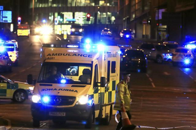 Emergency services work at Manchester Arena after reports of an explosion at the venue during an Ariana Grande gig in Manchester, England, on Monday. (AP Photo)
