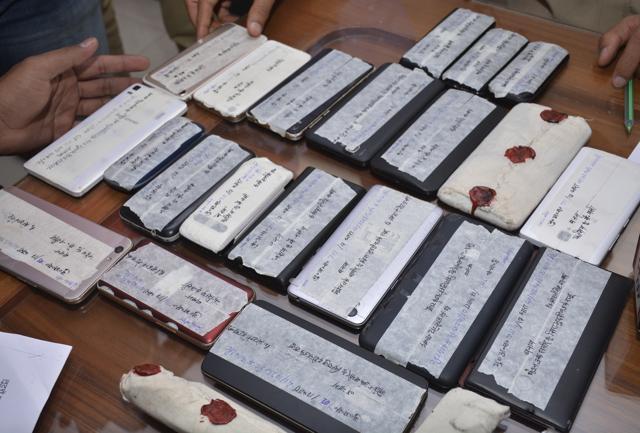 The phones recovered from the three men. (Sakib Ali /HT Photo) The phones recovered from the three men. (Sakib Ali /HT Photo)