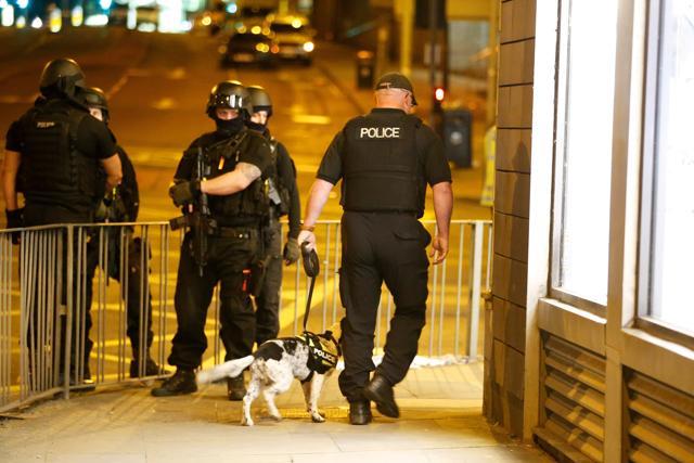Armed police officers stand near the Manchester Arena. (Reuters Photo) Armed police officers stand near the Manchester Arena. (Reuters Photo)
