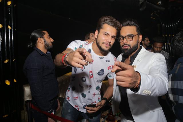Twinning in white: Singer, lyricist BIG Dhillon poses for the shutterbugs with Indeep.