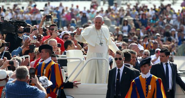 Pope Francis waves as he arrives to lead his Wednesday general audience in Saint Peter's square at the Vatican, on May 24. (Reuters Photo) Pope Francis waves as he arrives to lead his Wednesday general audience in Saint Peter's square at the Vatican, on May 24. (Reuters Photo)