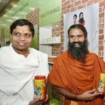 Yoga guru Ramdev and Acharya Balkrishna show their Patanjali products in New Delhi in 2016. (HT File Photo) Yoga guru Ramdev and Acharya Balkrishna show their Patanjali products in New Delhi in 2016. (HT File Photo)