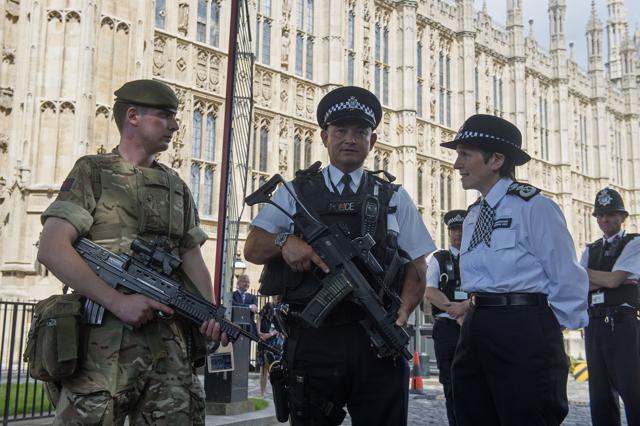 Metropolitan Police Commissioner Cressida Dick (R) meets soldiers and police officers on deployment at the Palace of Westminster in London on Wednesday. (AFP) Metropolitan Police Commissioner Cressida Dick (R) meets soldiers and police officers on deployment at the Palace of Westminster in London on Wednesday. (AFP)