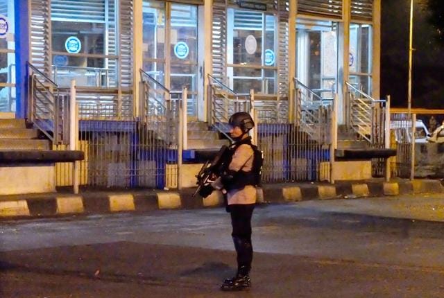 An armed Indonesian police officer guards a bus terminal in Jakarta after a suspected suicide bomber set off two blasts. (AFP) An armed Indonesian police officer guards a bus terminal in Jakarta after a suspected suicide bomber set off two blasts. (AFP)