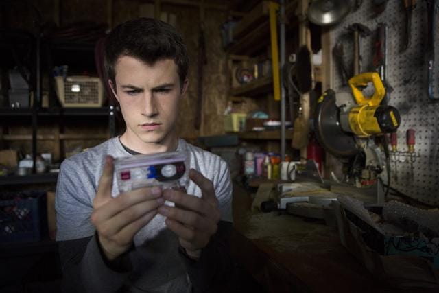The show follows a group of teens as they make their way through 13 accusatory audio tapes left behind by a classmate who committed suicide. (Beth Dubber / Netflix) The show follows a group of teens as they make their way through 13 accusatory audio tapes left behind by a classmate who committed suicide. (Beth Dubber / Netflix)