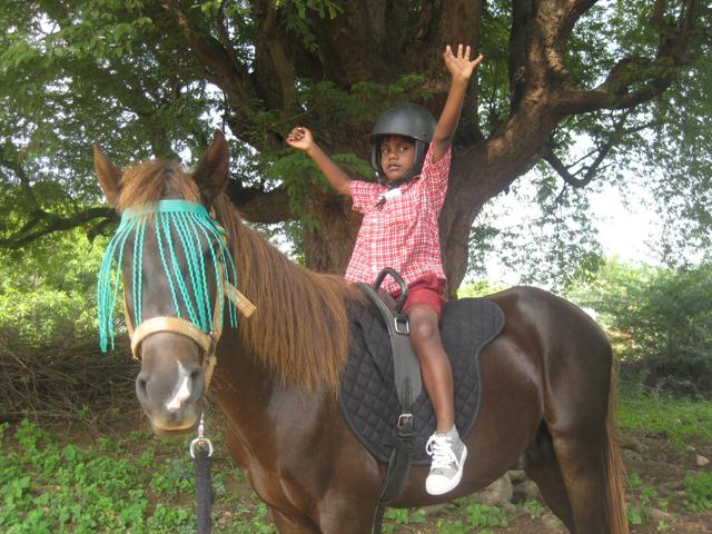A child rides the pony, Koko, at Intact Special School in Trichy. Ponies are best suited for differently abled children. Their size makes them less threatening than a horse.