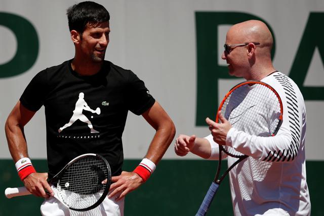 Novak Djokovic of Serbia and his coach Andre Agassi during a training session. (REUTERS) Novak Djokovic of Serbia and his coach Andre Agassi during a training session. (REUTERS)