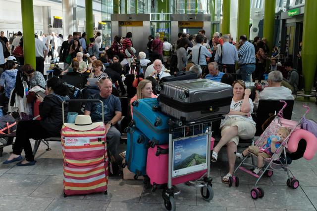 Travellers wait stranded at Heathrow Airport Terminal 5 after British Airways flights where cancelled at Heathrow Airport in west London. (AFP) Travellers wait stranded at Heathrow Airport Terminal 5 after British Airways flights where cancelled at Heathrow Airport in west London. (AFP)