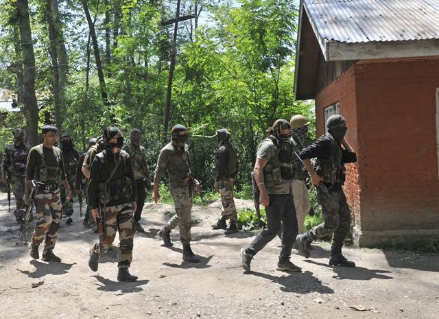Army soldiers and policemen patrol after a gunbattle ends at Saimoh village, in Tral area. (Waseem Andrabi / Hindustan Times) Army soldiers and policemen patrol after a gunbattle ends at Saimoh village, in Tral area. (Waseem Andrabi / Hindustan Times)