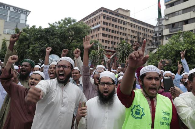 Supporters of Bangladesh Islami Sashontantra Andolon shout slogans against the reinstallation of the Lady Justice statue near the Supreme Court complex in Dhaka, Bangladesh, onSunday. (AP) Supporters of Bangladesh Islami Sashontantra Andolon shout slogans against the reinstallation of the Lady Justice statue near the Supreme Court complex in Dhaka, Bangladesh, onSunday. (AP)