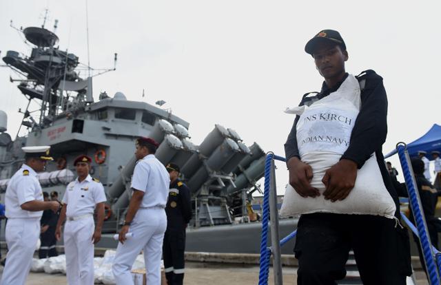 Indian Navy troops offload emergency supplies from the Indian ship Kirch at Colombo harbour in Colombo. (AFP Photo) Indian Navy troops offload emergency supplies from the Indian ship Kirch at Colombo harbour in Colombo. (AFP Photo)