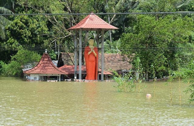 Floodwaters surround a temple in Bulathsinhala in Sri Lanka's Kalutara district on May 27, 2017. (AFP) Floodwaters surround a temple in Bulathsinhala in Sri Lanka's Kalutara district on May 27, 2017. (AFP)