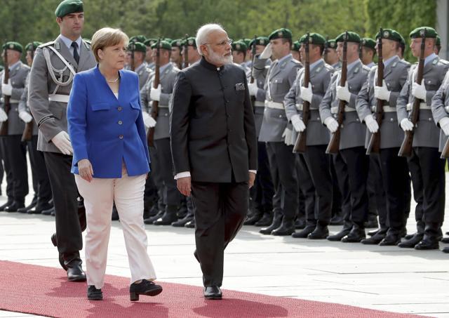 German Chancellor Angela Merkel, left, welcomes the Prime Minister of India, Narendra Modi, right, with military honors for a meeting at the chancellery in Berlin on Tuesday. (AP Photo) German Chancellor Angela Merkel, left, welcomes the Prime Minister of India, Narendra Modi, right, with military honors for a meeting at the chancellery in Berlin on Tuesday. (AP Photo)