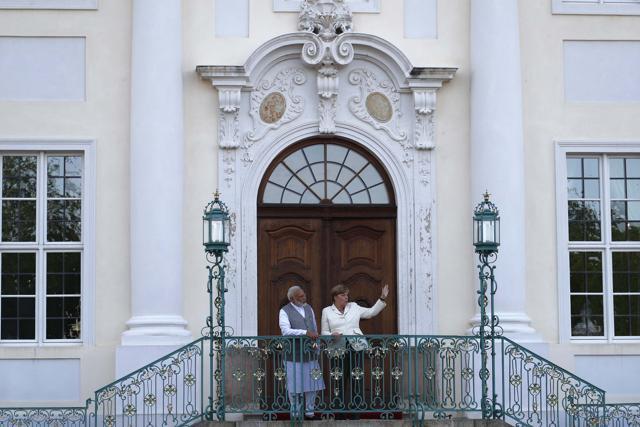 German Chancellor Angela Merkel talks to Indian Prime Minister Narendra Modi during their meeting at the German government guesthouse Meseberg Palace in Meseberg, Germany on May 29. (REUTERS) German Chancellor Angela Merkel talks to Indian Prime Minister Narendra Modi during their meeting at the German government guesthouse Meseberg Palace in Meseberg, Germany on May 29. (REUTERS)