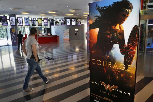 A man walks past a poster promoting the movie Wonder Woman at a cinema in downtown Beirut, Lebanon, on May 30, 2017. (AP) A man walks past a poster promoting the movie Wonder Woman at a cinema in downtown Beirut, Lebanon, on May 30, 2017. (AP)