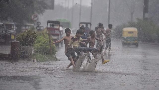 In pics: Delhi celebrates surprise pre-monsoon showers, more rain ...