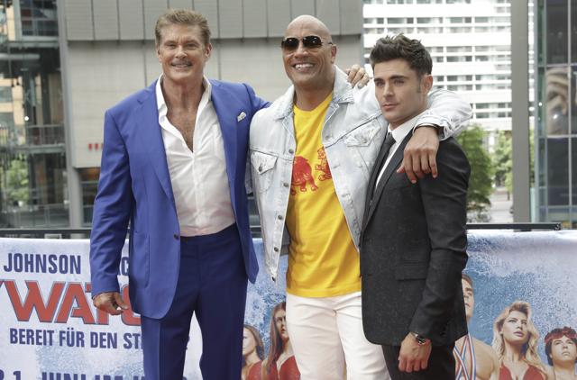 Actors David Hasselhoff, left, Dwayne Johnson and Zac Efron, right, pose during a photo call prior to the European premiere of Baywatch in Berlin. (AP) Actors David Hasselhoff, left, Dwayne Johnson and Zac Efron, right, pose during a photo call prior to the European premiere of Baywatch in Berlin. (AP)