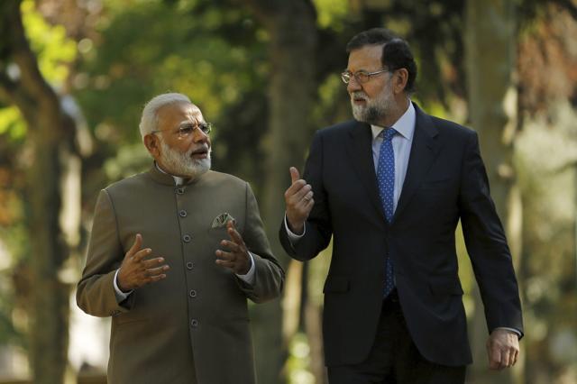 Prime Minister Narendra Modi with Spanish Premier Mariano Rajoy (R) in the gardens of the Moncloa Palace in Madrid, Spain. (AP Photo) Prime Minister Narendra Modi with Spanish Premier Mariano Rajoy (R) in the gardens of the Moncloa Palace in Madrid, Spain. (AP Photo)