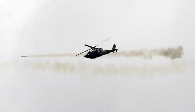 A Philippine air force attack helicopter fires a rocket as they continue to assault the Maute group in Marawi city, Philippines. (Reuters Photo) A Philippine air force attack helicopter fires a rocket as they continue to assault the Maute group in Marawi city, Philippines. (Reuters Photo)