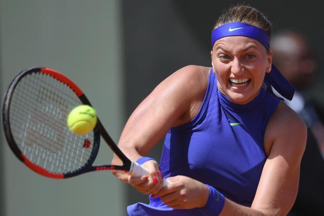 Petra Kvitova returns the ball to Bethanie Mattek-Sands. (AFP) Petra Kvitova returns the ball to Bethanie Mattek-Sands. (AFP)