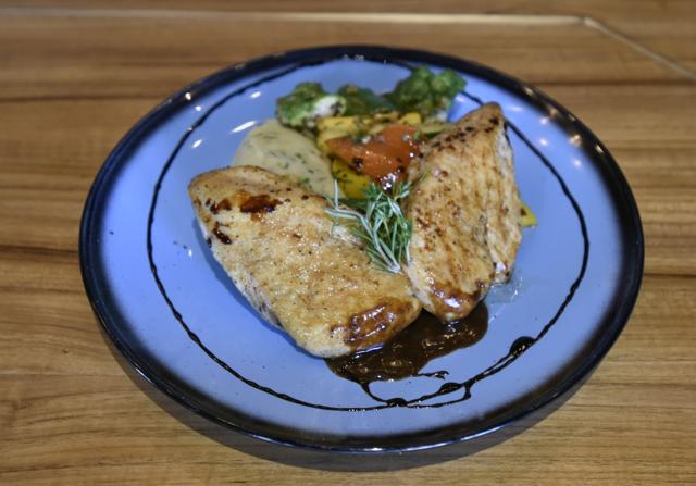 The juicy grilled chicken breast with buttery potato mash was straightforward but well-executed comfort food. (Kunal Patil / HT Photo)