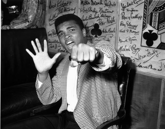 27th May 1963: Ali holds up five fingers in a prediction of how many rounds it will take him to knock out British boxer Henry Cooper. (Kent Gavin/Keystone/Getty Images) 27th May 1963: Ali holds up five fingers in a prediction of how many rounds it will take him to knock out British boxer Henry Cooper. (Kent Gavin/Keystone/Getty Images)